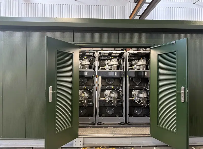 Inside: bank of commercial boilers in the same packaged plant room