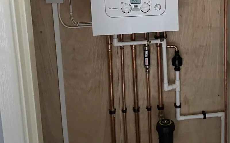 New combi boiler installation with neat copper pipework and magnetic filter by CombiCert, Telford