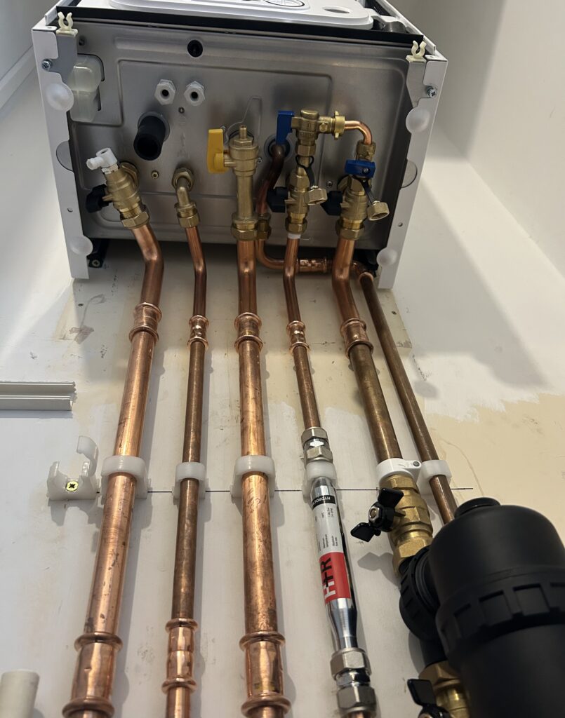 Copper pipework and magnetic filter on a new boiler install